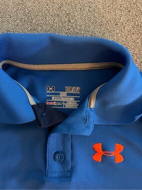 Boys Under Armour Blue Polo with Orange Logo